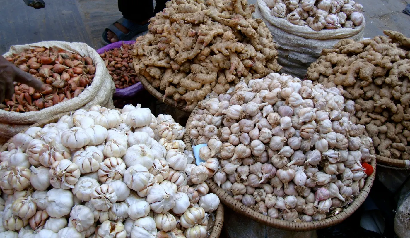 Nepali market - Beautiful display of herbs and spices - fresh ginger - two different varieties of garlic and shallots.