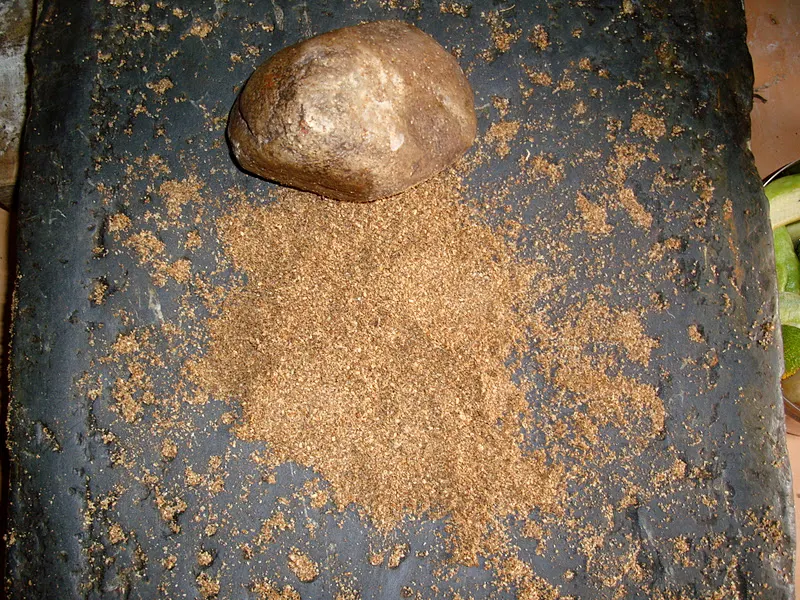 A typical multi-purpose grinding stone in Nepal. The seeds are lightly toasted and ground in Silauto to get correct consistency before adding to a dish. This method is effective when grinding small quantities.
