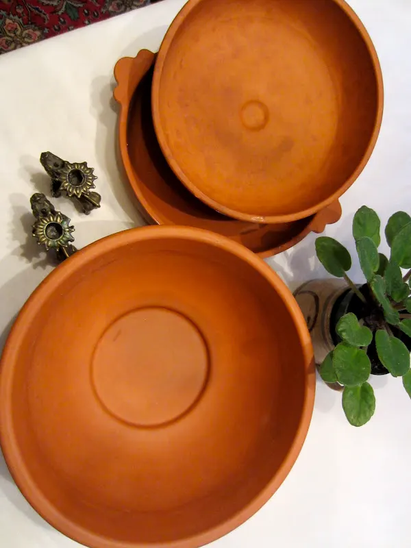 Picture of unglazed, natural clay pot bought here in the United States to recreate Nepali Juju Dhau. From Jyoti's collection.....