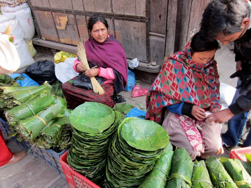 Street vendor selling saal leaves during festival times.