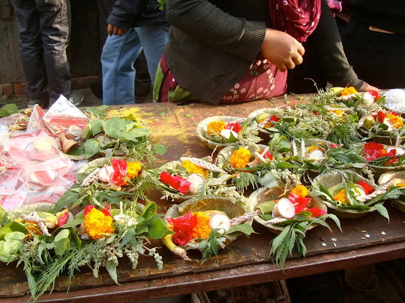 Around many temple areas - vendors are selling floral offering, incense, other religious objects placed in the fresh hand-stitched tapari plates.