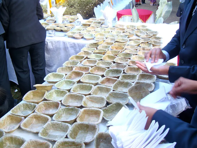 The rectangular machine-made dry leaf plates (chaar-kune tapari) - used in one of the pre-wedding feast (bhoj) given by my friend, Pratima, for her son's marriage.
