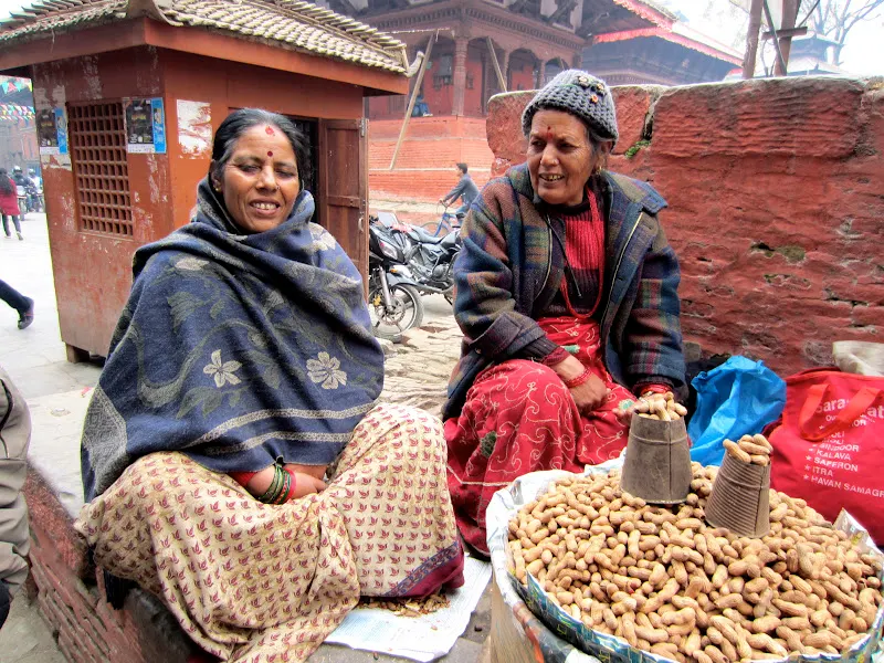 Taking a picture of two women selling Peanuts (Badaam) in a popular tourist area near Basantapur, Kathmandu.