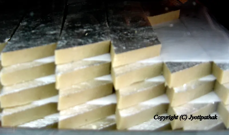 Cashew Burfi (काजु को बर्फी) - most delicious diamond shape burfi made from pure ground cashew nuts, sugar, flavoring and garnished with silver varak paper.