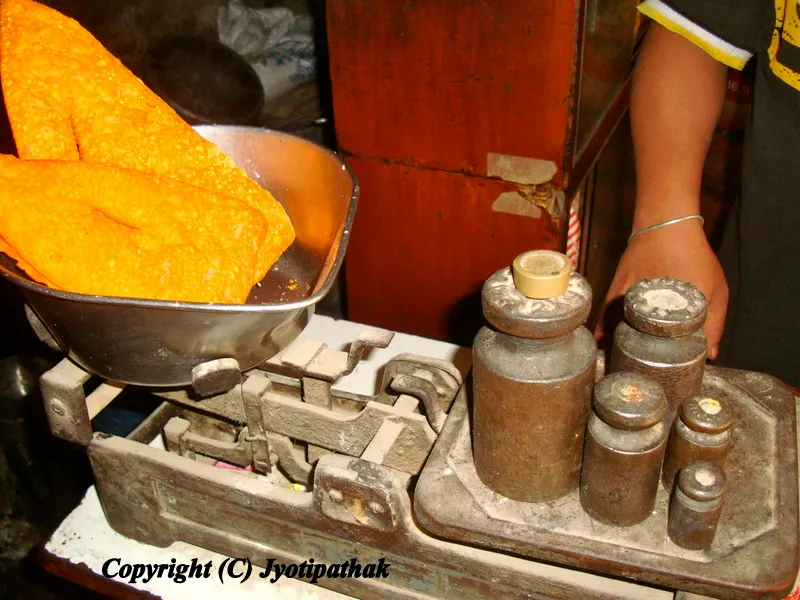 Triangular shaped yellow Nimki - ( निम्की)