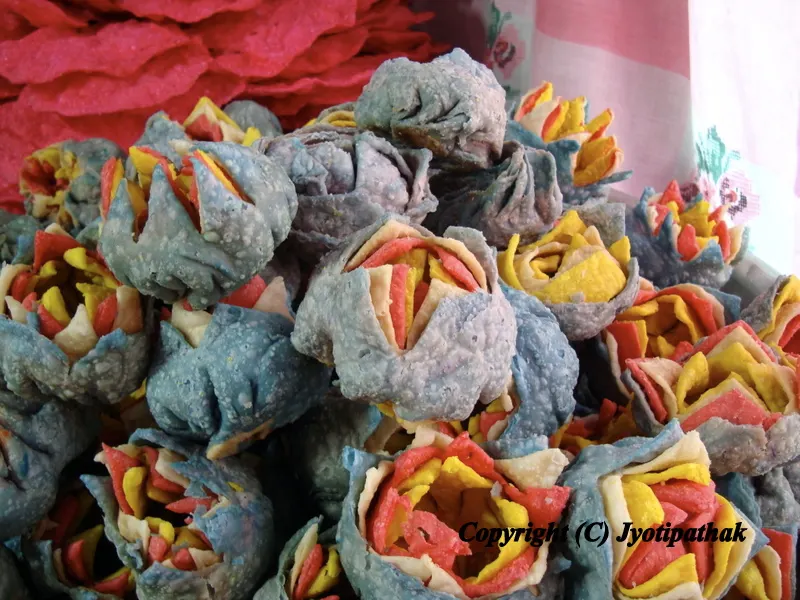 Rose shaped Fini breads made from wheat flour, butter or shortening oil, coloring, water and sugar.