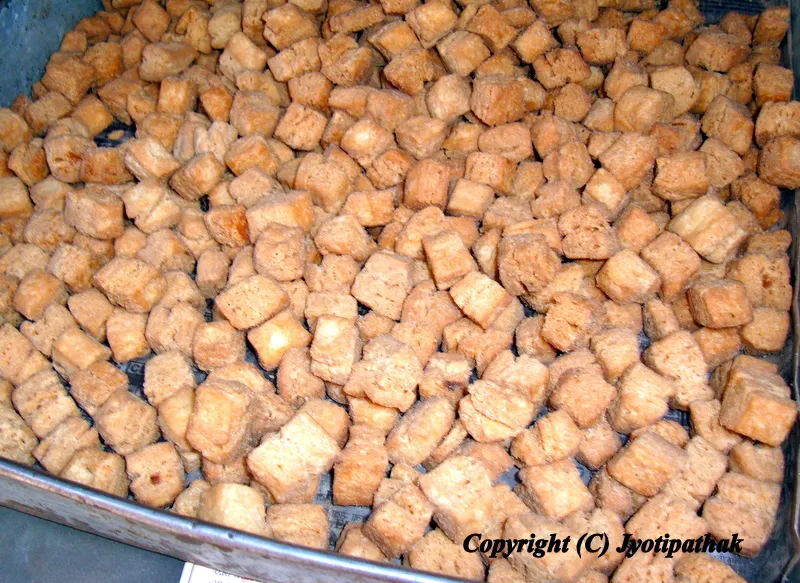 Variation of sugar-glazed Mari breads comes in various sizes and shapes - circles, spirals, braids , diamond- shape, or simply small squares.