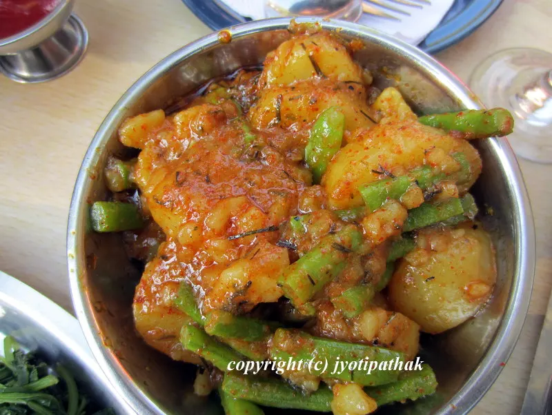 A well seasoned aloo ko achaar made with a combination of slightly steamed fresh asparagus, dry-roasted sesame seeds, Szechwan peppers, with mustard oil tempering of fenugreek seeds, jimbu (Himalayan herb), and turmeric powder.