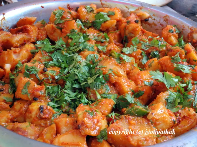 Spicy aloo ko Achaar made for outdoor picnic - the red khursaani (cayenne pepper) and chopped fresh coriander (cilantro) adds a little color and flavor to the dish.