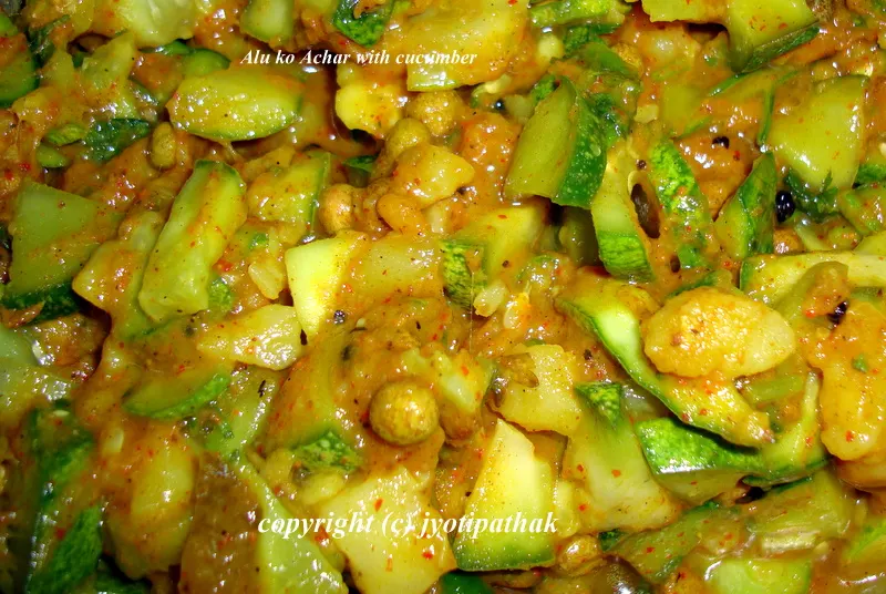 This full-flavored aloo ko achaar is made with diced cucumbers, chopped green bell peppers, dried yellow peas (soaked), jalapeno peppers, and tempered with fenugreek seeds. The cucumber gives to the dish a fresh crunchy flavor.