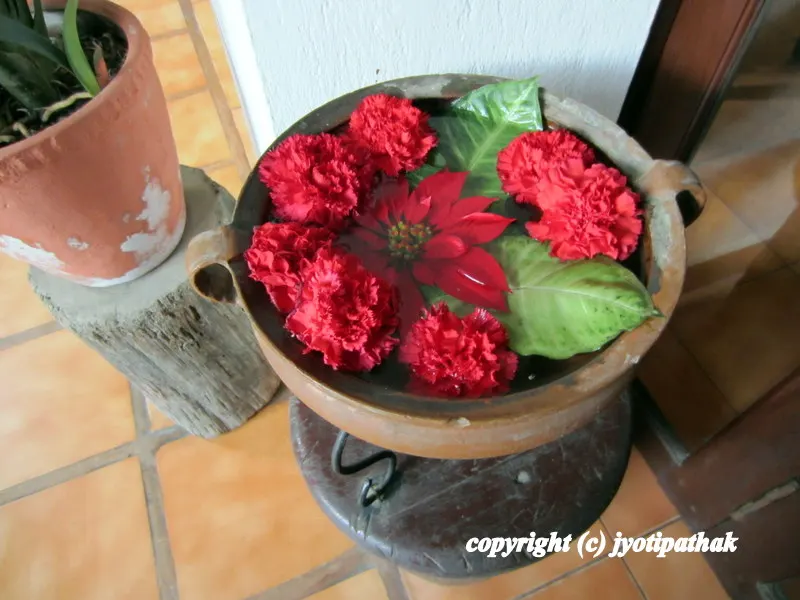 ... looking at this beautiful display of floating flower bowl in a pedestal, placed in a private entrance of a Nepali home ....