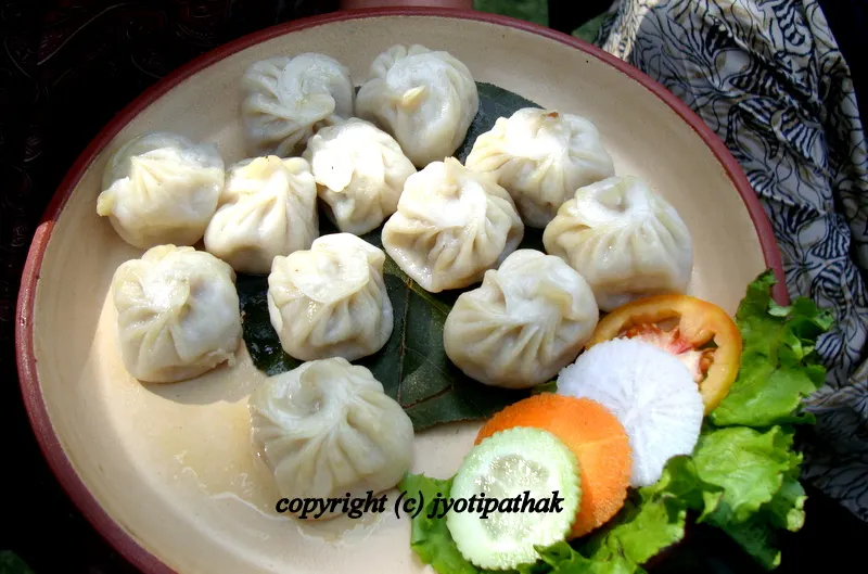 When it comes to simple, delicious, one-meal dishes of Nepal, you can't beat the famous MOMOS म:म: served with a variety of dipping sauces.