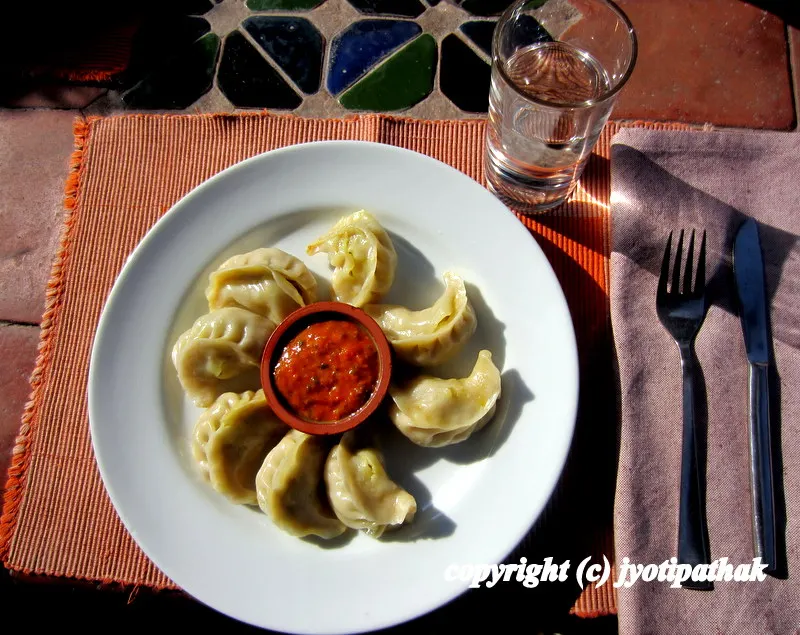 Welcome family and friends! Here are my mouthwatering momos served with hot and fiery tomato chutney (मोमो र पीरो गोलभेडा को अचार).