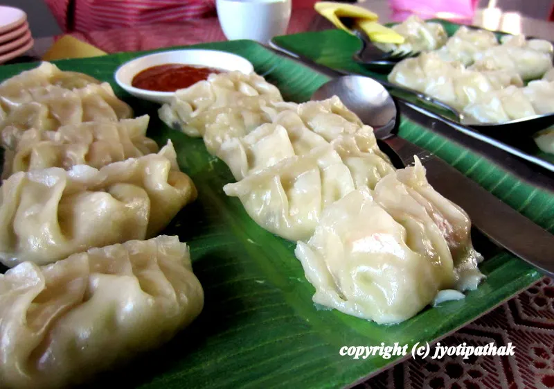 Here is a picture of freshly steamed vegetarian momo (mushroom, cabbage, carrot, shredded paneer cheese) served in a fancy decorative platter