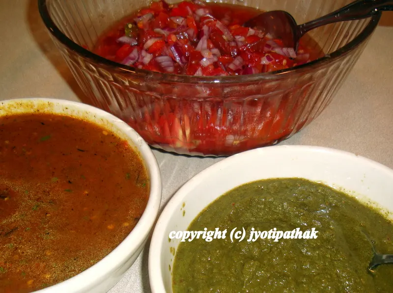 Momo dipping sauces - (left) hot & spicy classic momo sauce made with tomato, chili pepper, ginger, garlic, sesame seeds, lemon juice, (back) no cook salsa style tomato sauce (right) cilantro chutney.