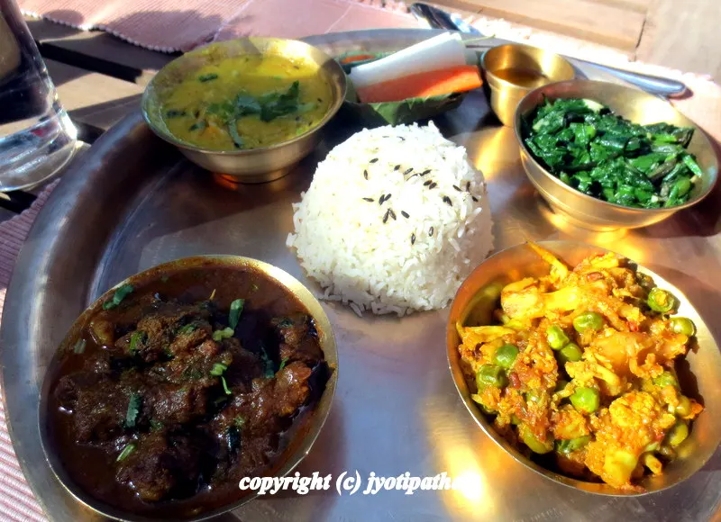 Serving Nepali Daal-Bhaat-Tarkaari - Nepalese find goat meat very tasty and usually it is a treat to serve tender goat curry for a special occasion.