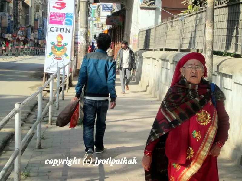 A Thakali Aamaa is busy shopping during Dashain festival in the New Road area (नयाँ सडक), one of the busiest market place in Kathmandu