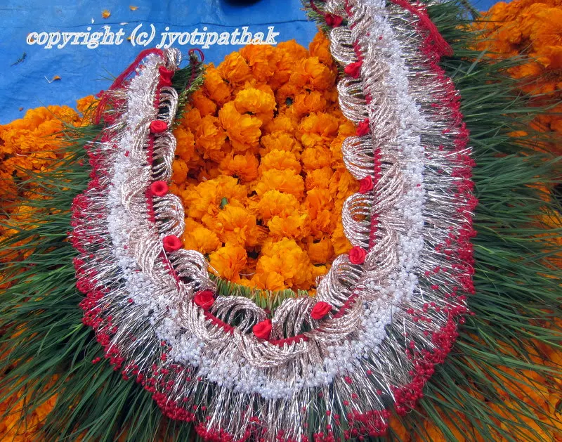 Picture of a traditional green garland especially made for a Nepali wedding - some garland maker will custom make dubo ko maalaa according to customer's specification.