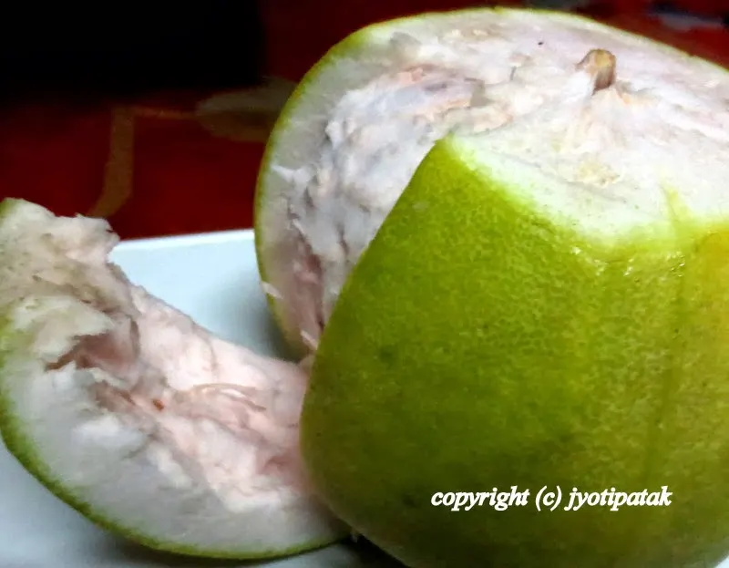 Cut several vertical slice-lines all around the pomelo moving your knife from top to bottom. Pull each outer thick-spongy skin. You may have to use some force.
