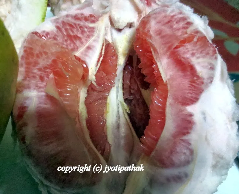 Pull away all the membrane that surrounds each segments and continue this process until you have removed it all.