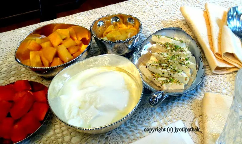 Freshly cut-up tree ripened mangoes, papaya, ripe jack fruit, home-made yogurt and cashew-pistachios barfi (phalphul, dahi, barfi)
