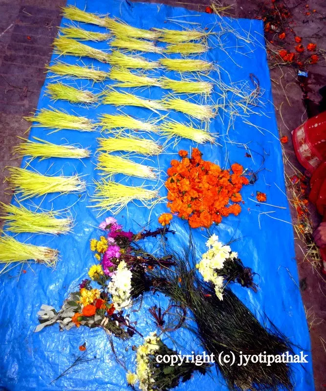 Jamaraa tied into small bundles are for sale at a local market during auspicious tikaa day