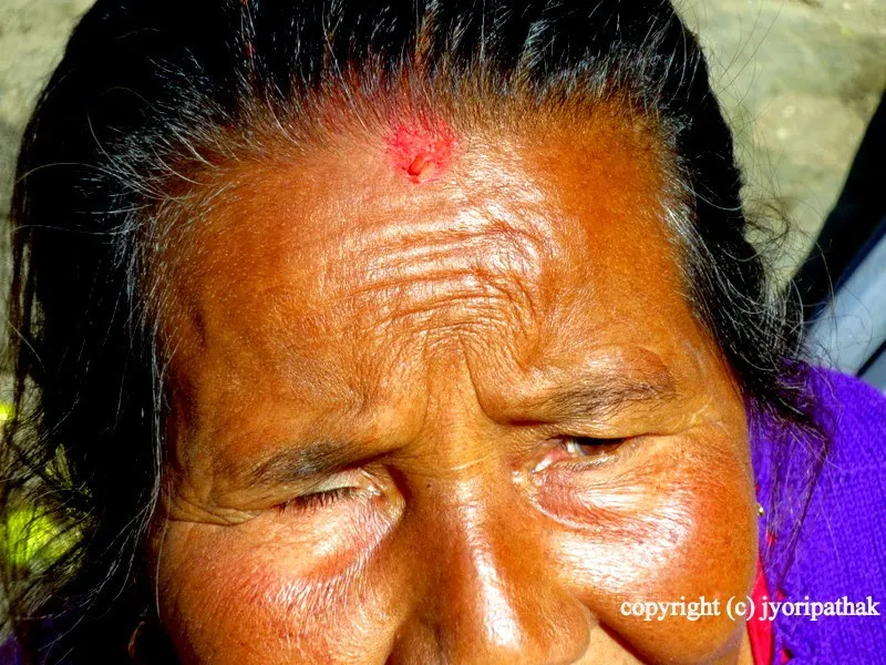 Sweet gentle smile and a few creases from her face - this lady is happy to show me her tikaa - she says, "everyday is a blessing and a gift of god, I try to enjoy all the chahaad pahaad haru (festivals)".