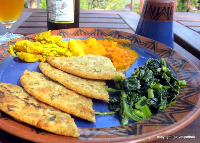 Potato stuffed bread with mustard greens, cauliflower, daal - vegetarian lunch - a delicious way to warm up on a cold winter afternoon.